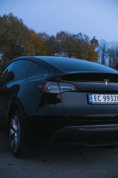 Tonsberg, Norway - October 27, 2021: black Tesla model Y Long Range Dual motor is an electric car  - Φωτογραφία, εικόνα