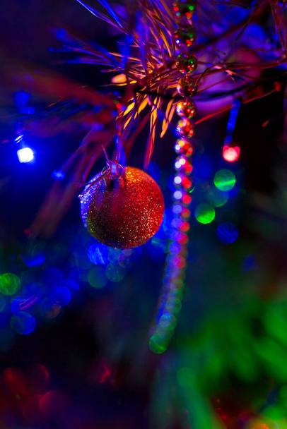 Christmas sparkling toys with illumination. Decorative toys on Christmas tree. concept is Christmas - Photo, Image