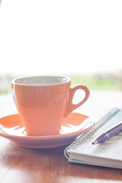 Cup of coffee with pen and notebook - Photo, Image