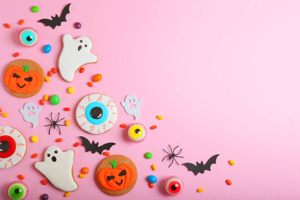 Halloween sweets on colored background close up top view with place for text - Фото, изображение