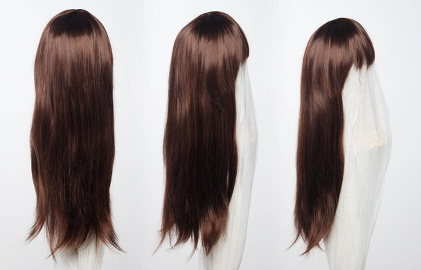 Brown brunette long straight hair wig on mannequin head over white background isolated, set of three to show many angle of hair style wave and light point of view - Fotó, kép