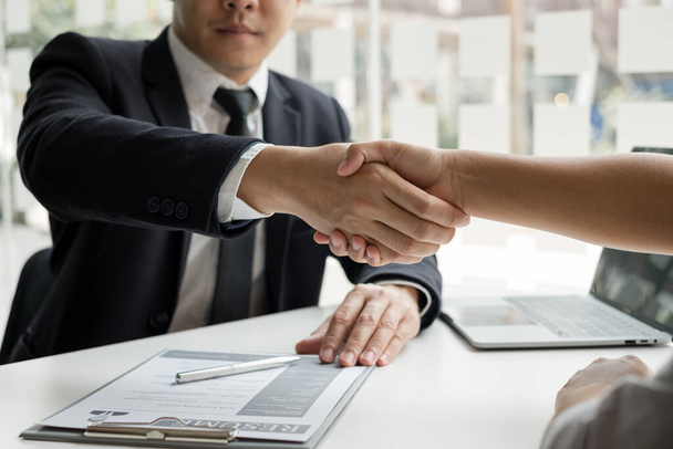 Employer shake hand with job applicants congratulates and welcomes new hires after successful negotiations for a job interview. Recruitment concepts. - Photo, Image