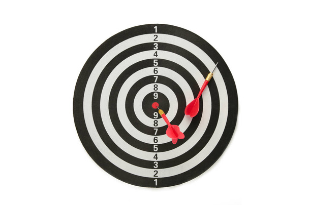 Dart board with red darts isolated on white background. Top view. - Фото, зображення