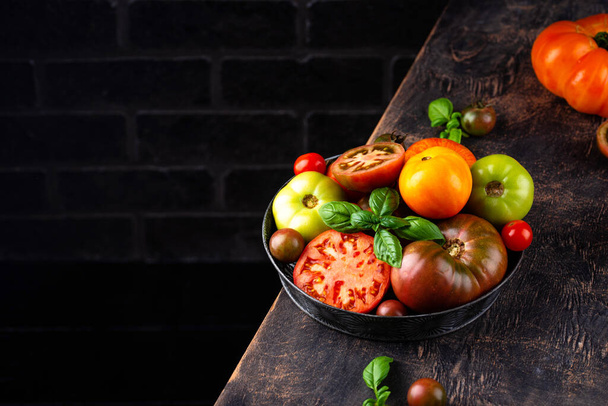 Assortment of different colorful tomatoes - Foto, imagen