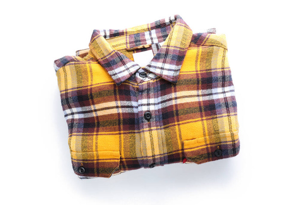 Checkered shirt isolated on white background, top view. - Fotografie, Obrázek