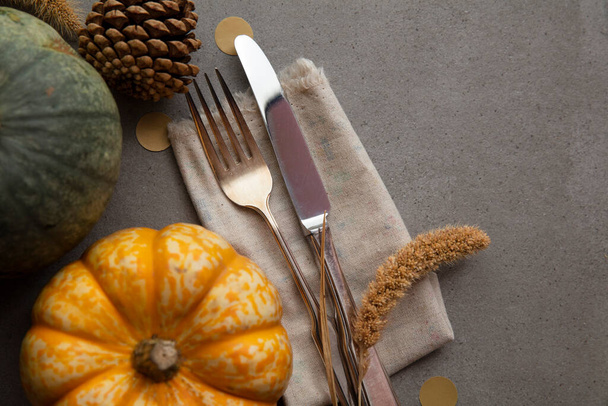 Autumn place setting lifestyle thanksgiving background with cutlery and pumpkins - Φωτογραφία, εικόνα