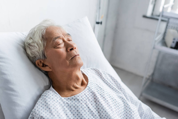 Senior asian patient sleeping on bed in hospital ward  - Photo, Image