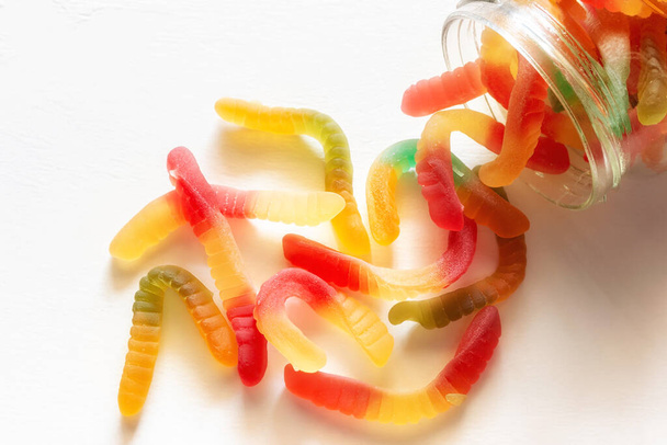 scattering from a jar of gummy worms - Zdjęcie, obraz