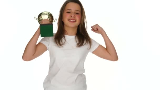 Triumphant jubilant young schoolgirl with a trophy - Imágenes, Vídeo