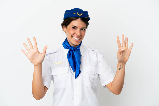 Stewardess kaukasischen Frau isoliert auf weißem Hintergrund zählen neun mit den Fingern - Foto, Bild