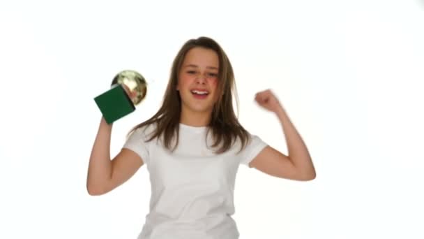 Triumphant jubilant young schoolgirl with a trophy - Footage, Video