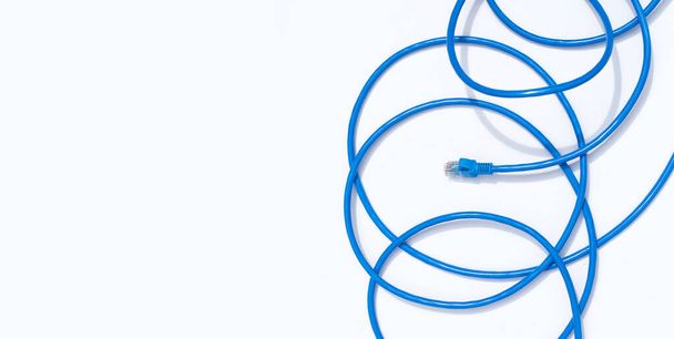 LAN network connection ethernet blue cables on white background. - Foto, Bild