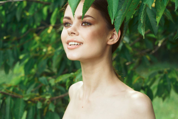 beautiful woman skin care bare shoulders green leaves nature Lifestyle - Фото, зображення