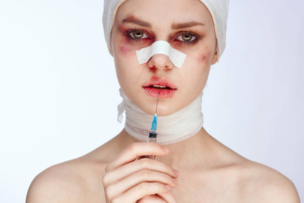 emotional woman plastic surgery operation bare shoulders light background - Photo, Image
