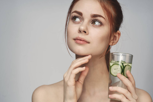 woman with cucumber drink health vitamins close-up - Φωτογραφία, εικόνα