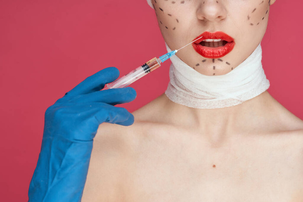 beautiful woman in blue gloves syringe in hands contour on the face lifting studio lifestyle - Foto, Imagem