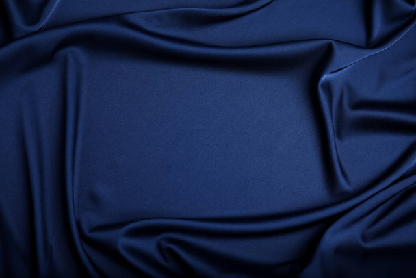 Crumpled dark blue silk fabric as background, top view. Space for text - Фото, зображення