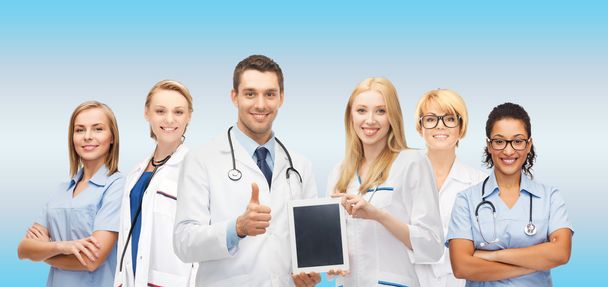 team or group of doctors with tablet pc computer - Valokuva, kuva