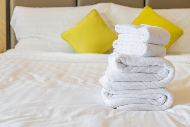 white towel fold on bed in hotel resort - Fotoğraf, Görsel