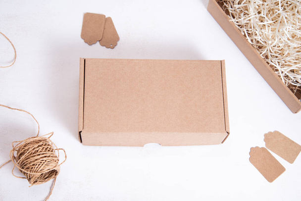Brown Cardboard Carton box, flat, on office desk - Fotoğraf, Görsel