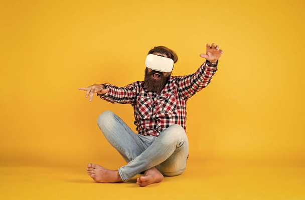 So real. Future technology concept. Visual reality concept. guy getting experience using VR-headset glasses. bearded hipster use modern technology. man with glasses of virtual reality - 写真・画像