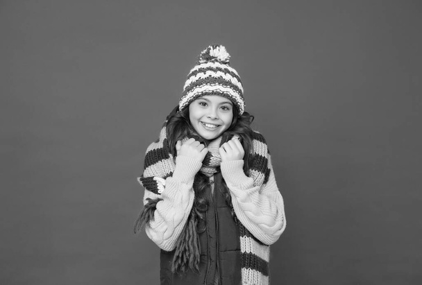 kid with happy face wearing warm winter clothing and get ready for holidays, knitted accessory - 写真・画像