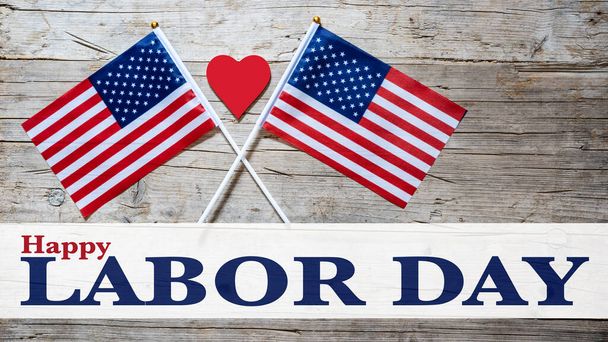 Happy Labor Day background banner greting card template - American flags, red heart and lettering, isolated on rustic wood texture, wooden table, top view - Foto, afbeelding