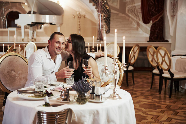 So cute pair. Beautiful couple have romantic dinner in luxury restaurant at evening time. - Fotografie, Obrázek