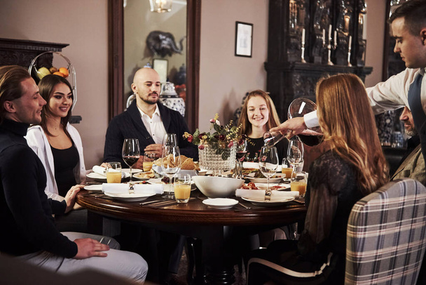 Everyone is happy. Family friends having nice time in beautiful luxury modern restaurant. - Valokuva, kuva