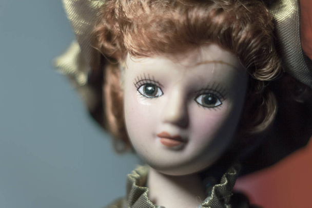 Luxurious doll in the form of a girl in a dress and hat - 写真・画像