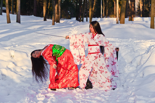 Beautiful brunette girls in a japanese kimono - Foto, imagen