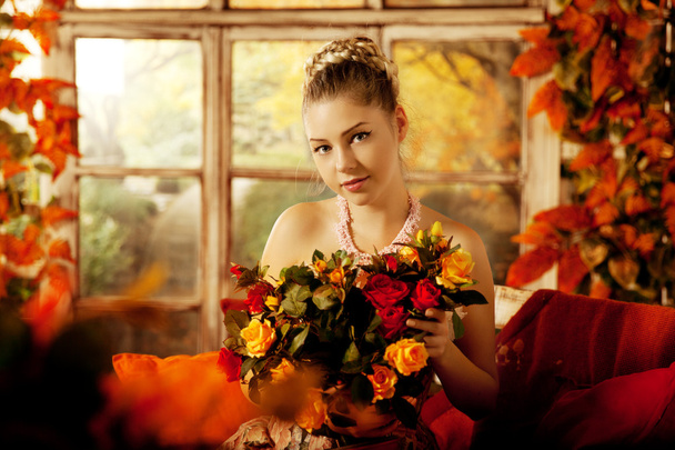 Young woman in vintage dress on autumn porch. Beauty  girl in fa - Photo, Image