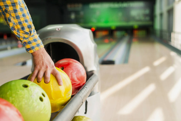 person taking bowling ball. High quality photo - Foto, afbeelding