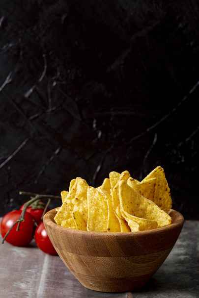 tasty nachos wooden bowl tomatoes. High quality photo - Photo, Image