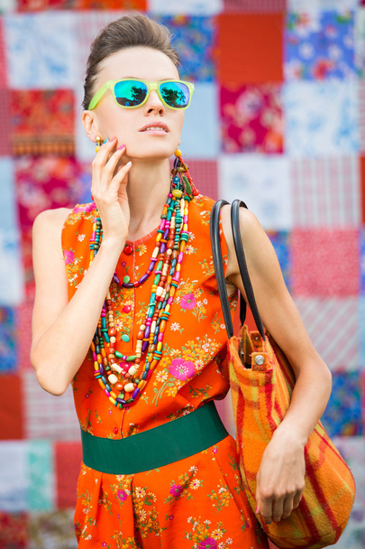 Stylish woman wearing sunglasses and accessories - Foto, afbeelding