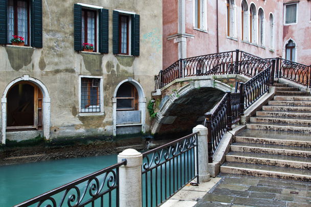 Typical canal scene with an old bridge in Venice, Italy - Valokuva, kuva