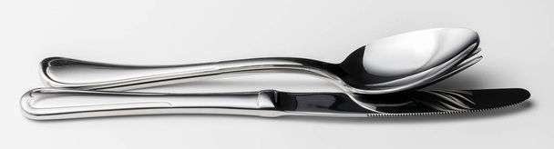 Spoon, fork and knife on a white background - Photo, Image
