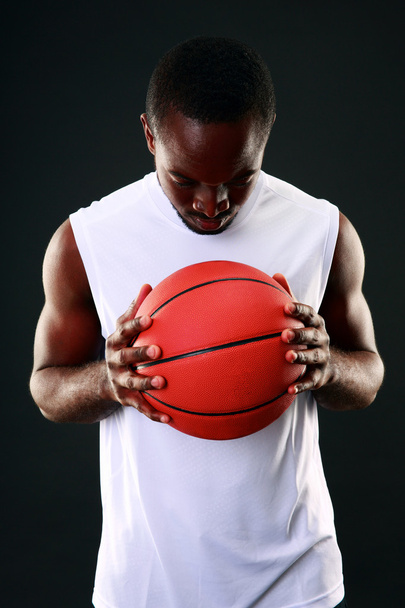 Handsome sports african man over black background - Fotografie, Obrázek