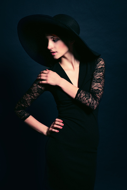 Woman in black dress and hat - Photo, Image