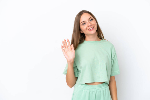 Young Lithuanian woman isolated on white background saluting with hand with happy expression - Φωτογραφία, εικόνα