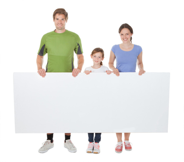 Family  Holding Blank Billboard - 写真・画像
