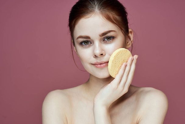 woman with bare shoulders sponge in hands clean skin hygiene - Photo, image