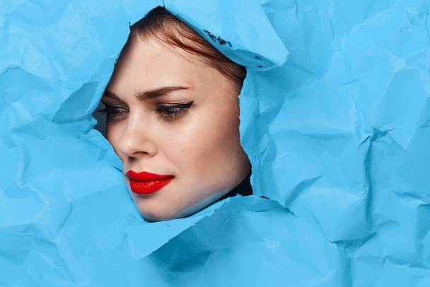 female face blue background red lips makeup emotions - Foto, Bild