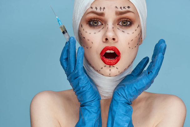 a person Red lips plastic surgery operation bare shoulders blue background - Fotó, kép