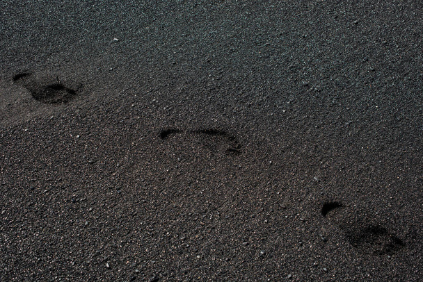 Nahaufnahme des vulkanischen schwarzen Sandes - Foto, Bild