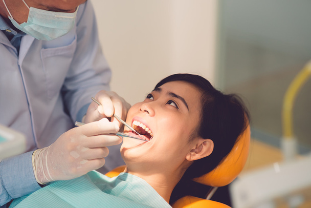 Woman having her teeth examined - Photo, Image