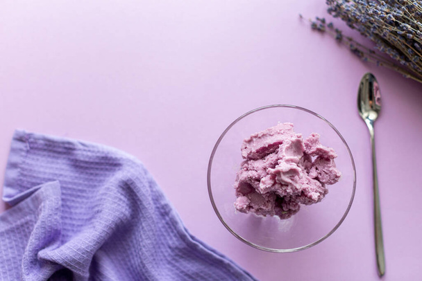 lavender ice cream on a purple background with dried lavender flowers - Fotoğraf, Görsel