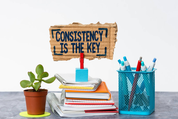 Handwriting text Consistency Is The Key. Business idea by Breaking Bad Habits and Forming Good Ones Tidy Workspace Setup Writing Desk Tools And Equipment Displaying Message - Photo, Image