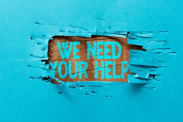 Ручной знак "Нам нужна твоя помощь". Слово за то, что попросите кого-нибудь встать с вами на защиту от трудностей, придумывая новые идеи и вдохновляя на прорывные решения. - Фото, изображение