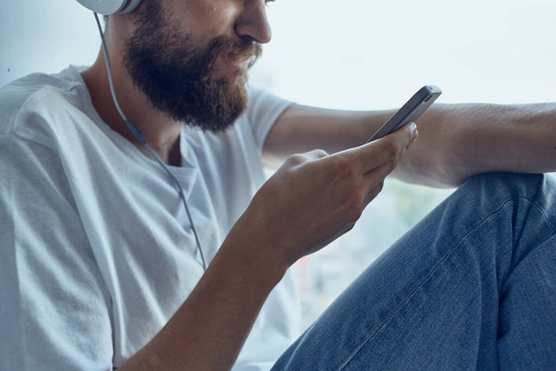 Man sitting in the room with headphones communication - Photo, Image